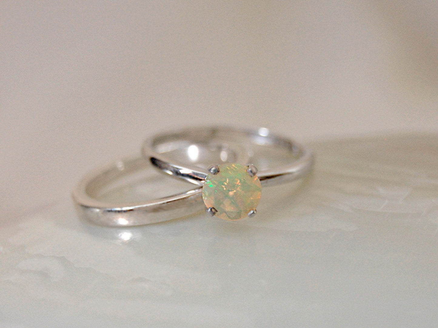 Callie - Solitaire Ring Features a Brilliant Opal Set in Solid Rhodium Plated Sterling Silver for Ease of Care. FREE SHIP US.