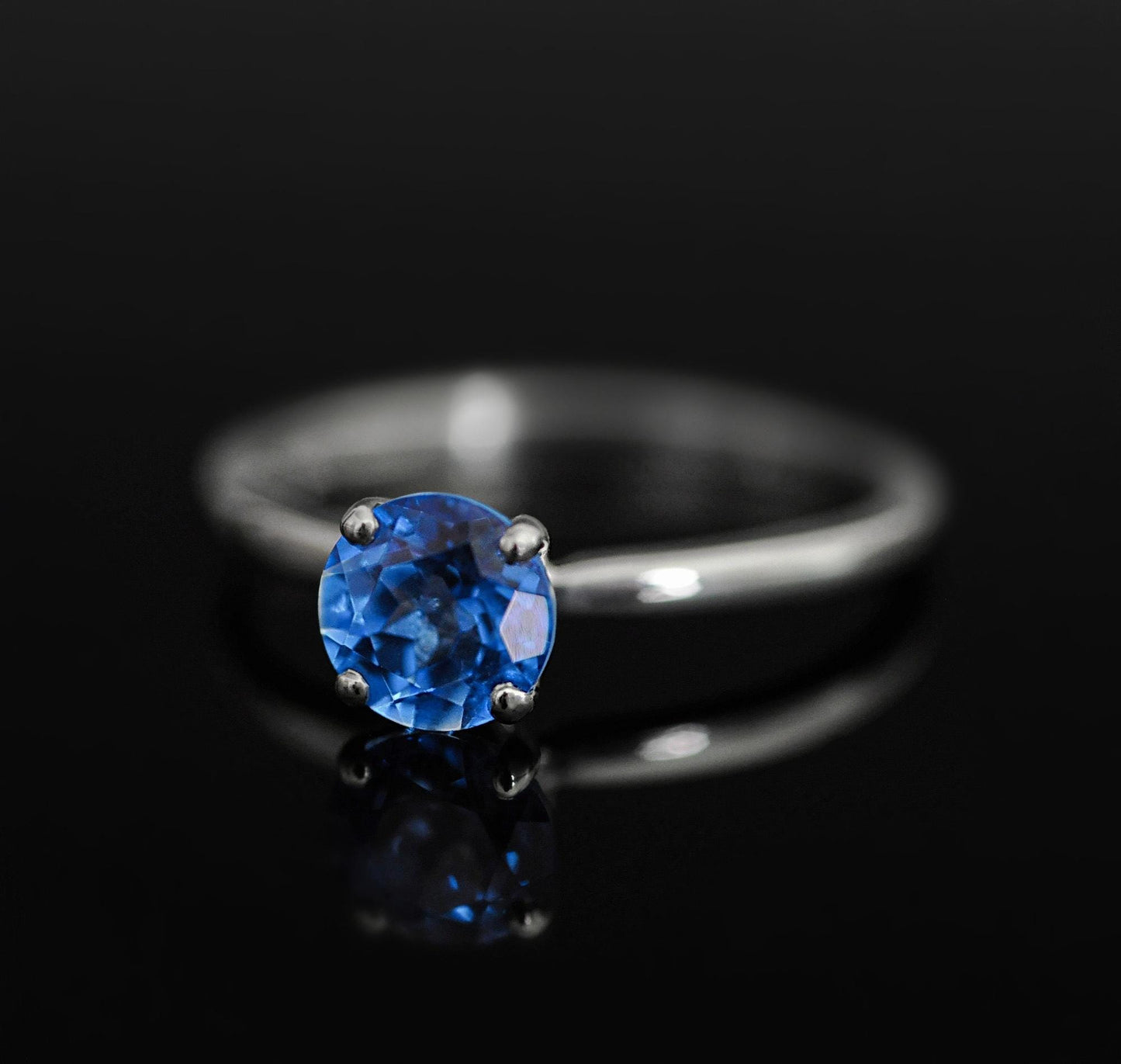 Makynna - Bright and Beautiful Blue Topaz Solitaire Ring Set in Solid Sterling Silver, Rhodium Plated for Ease of Care. Free Shipping in US.