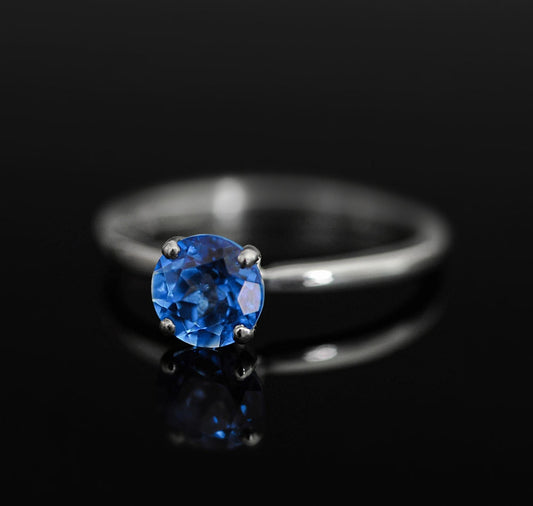 Makynna - Bright and Beautiful Blue Topaz Solitaire Ring Set in Solid Sterling Silver, Rhodium Plated for Ease of Care. Free Shipping in US.