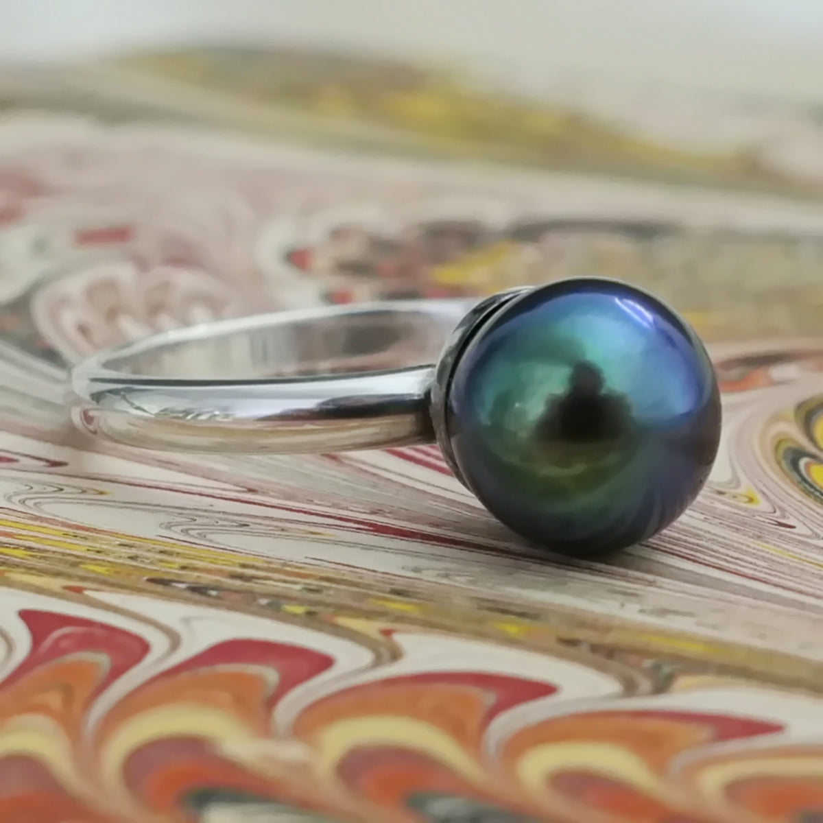 Inger- Pearl Solitaire Ring Features a Blue Green Akoya Pearl Set in Solid Sterling Silver.