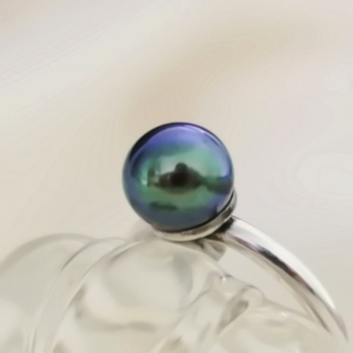 Inger- Pearl Solitaire Ring Features a Blue Green Akoya Pearl Set in Solid Sterling Silver.