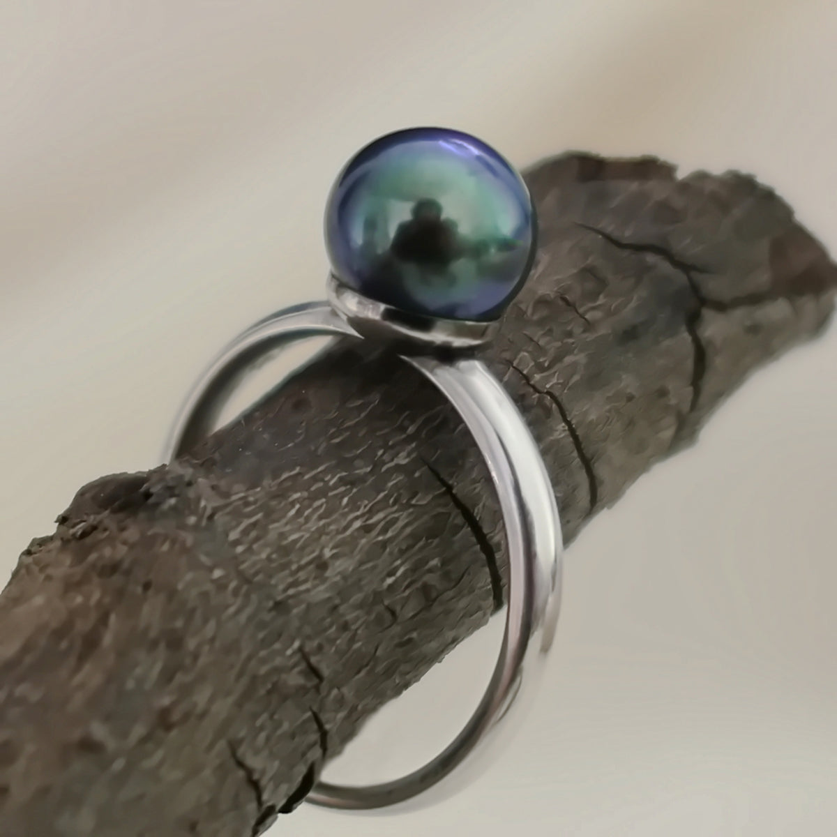 Inger- Pearl Solitaire Ring Features a Blue Green Akoya Pearl Set in Solid Sterling Silver.
