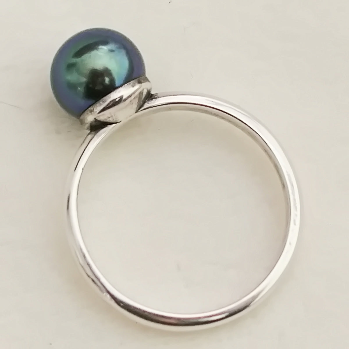 Inger- Pearl Solitaire Ring Features a Blue Green Akoya Pearl Set in Solid Sterling Silver.