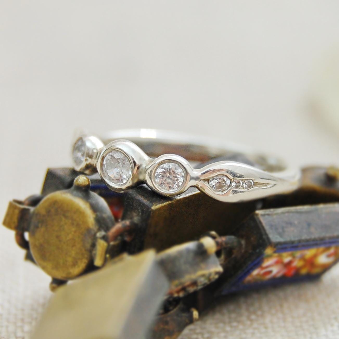 Nora - Delicately Beautiful Three Stone Engagement, Commitment or Stacking Ring with Accent CZ Side Gemstones, Set in Solid Silver.