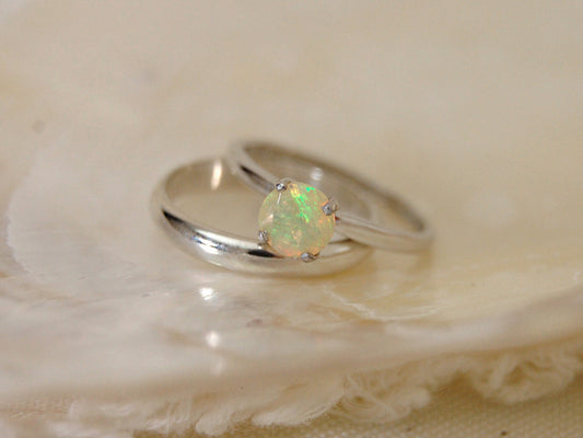 Callie - Solitaire Ring Features a Brilliant Opal Set in Solid Rhodium Plated Sterling Silver for Ease of Care. FREE SHIP US.