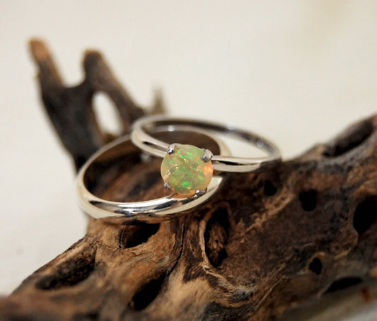 Callie - Solitaire Ring Features a Brilliant Opal Set in Solid Rhodium Plated Sterling Silver for Ease of Care. FREE SHIP US.
