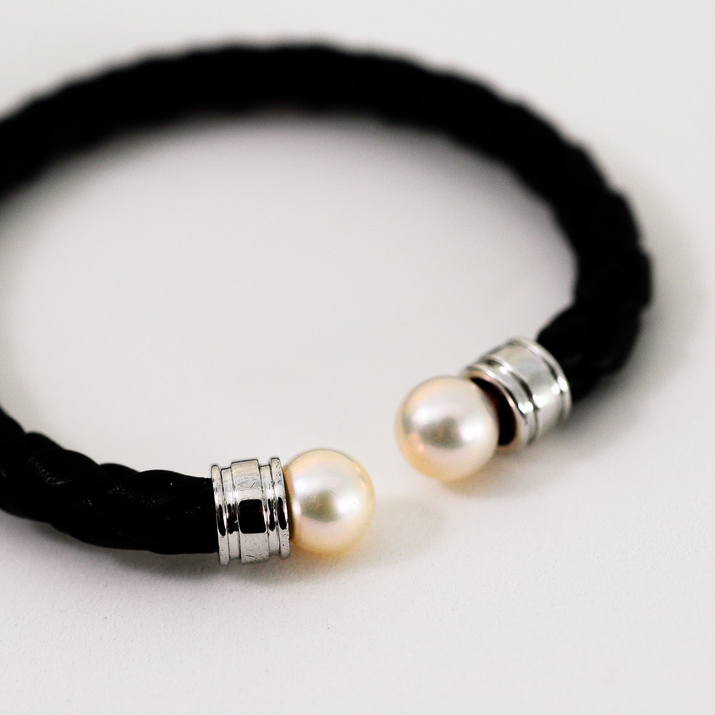Ciara - Cuff Bracelet Features Perfectly Matched Pearls Set on a Flexible, Braided Leather and Sterling Silver Cuff.