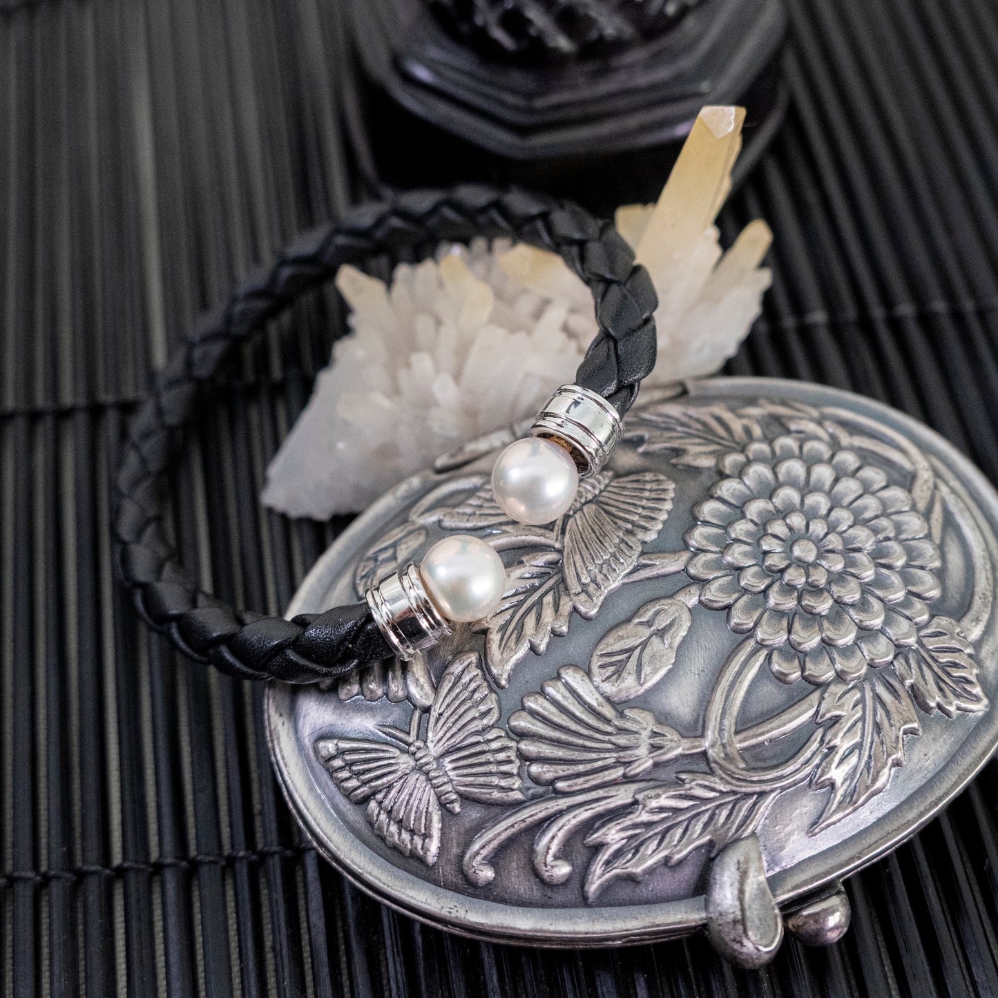 Ciara - Cuff Bracelet Features Perfectly Matched Pearls Set on a Flexible, Braided Leather and Sterling Silver Cuff.
