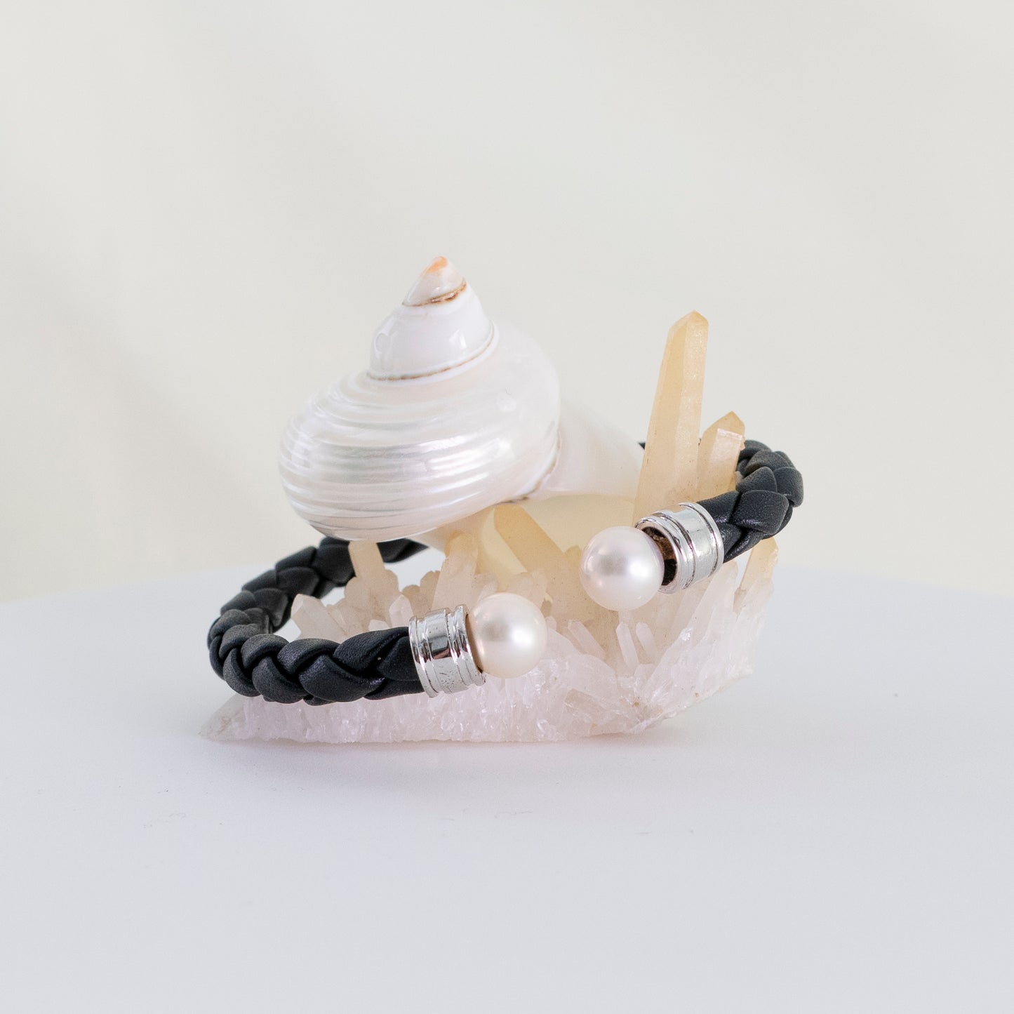 Ciara - Cuff Bracelet Features Perfectly Matched Pearls Set on a Flexible, Braided Leather and Sterling Silver Cuff.