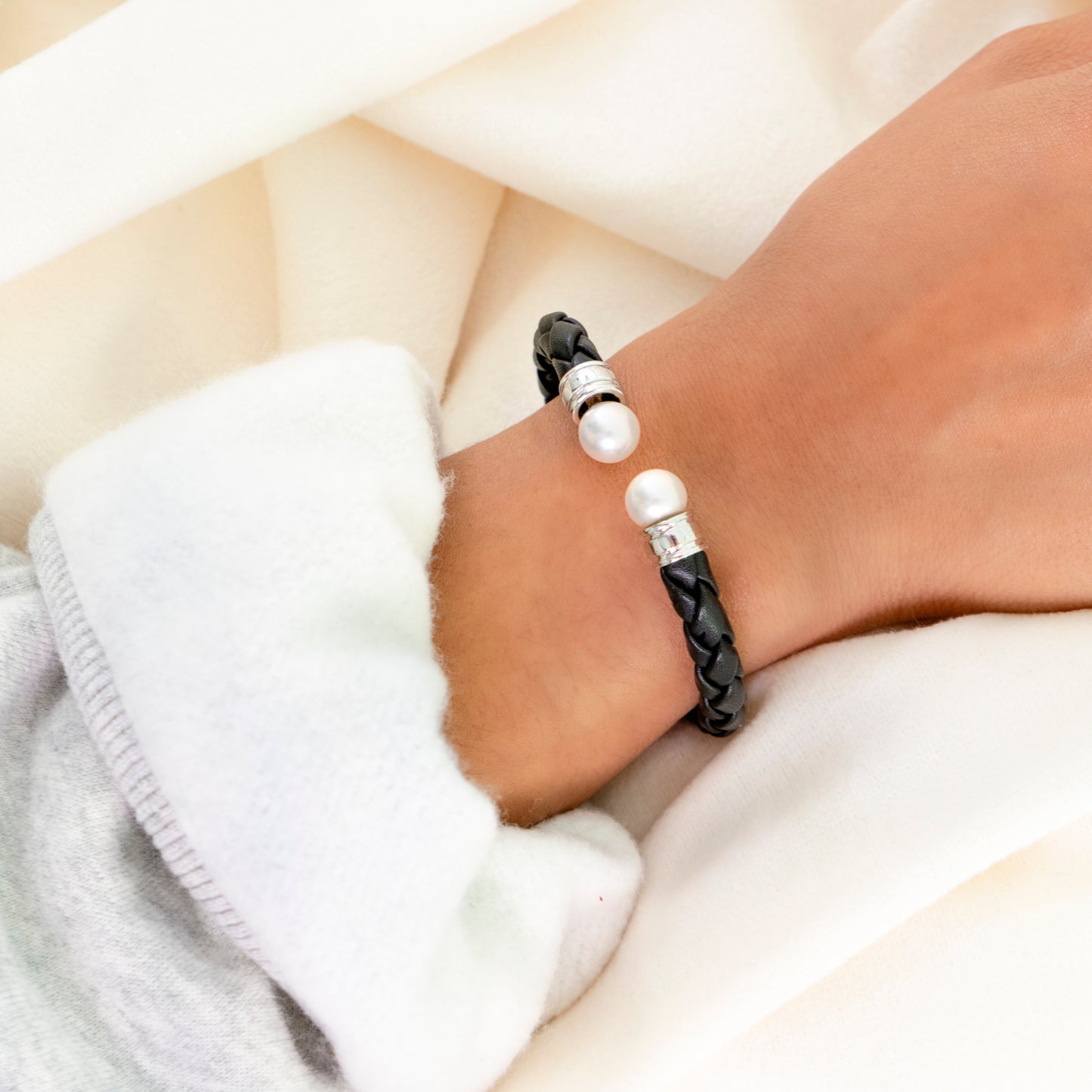 Ciara - Cuff Bracelet Features Perfectly Matched Pearls Set on a Flexible, Braided Leather and Sterling Silver Cuff.
