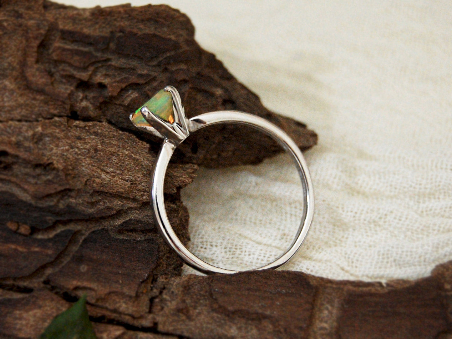 Callie - Solitaire Ring Features a Brilliant Opal Set in Solid Rhodium Plated Sterling Silver for Ease of Care. FREE SHIP US.